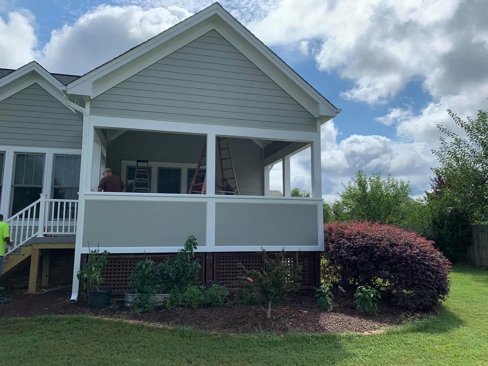 Covered porch addition tied into home roofline