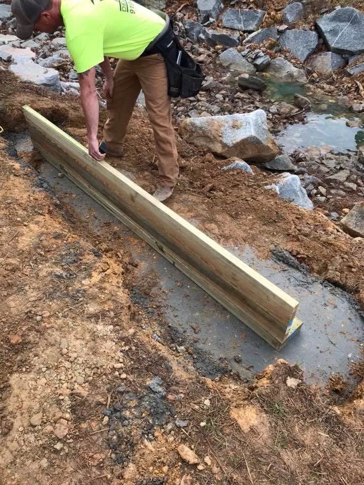 Concrete footings and heavy support posts installed
